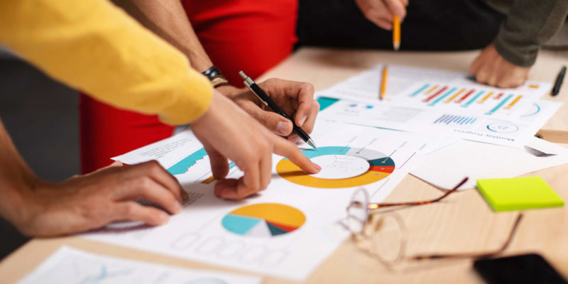 marketing team reviewing reports