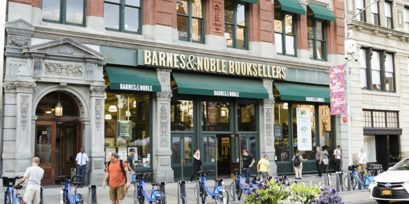 A Barnes and Noble store across the street from Union Square Park. People can be seen.