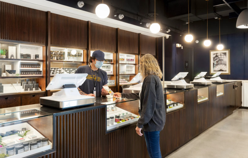 customer purchasing cannabis in retail store
