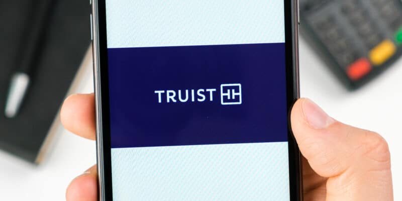Purple Truist App on phone being held by white hand